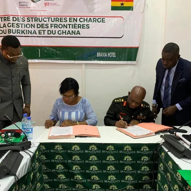 kotia and secretary sign