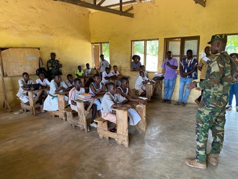 Sensitisation exercise in Saru and Sawla-Tuna-Kalba District - 7th October 2024 commander ocloo with school children in saru sensitization 24 2
